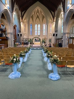 Church flowers ready for the bride