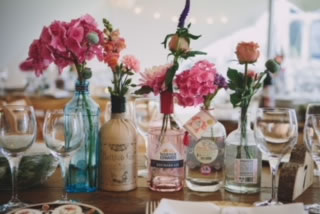 beautiful flowers in bottles for bridal display