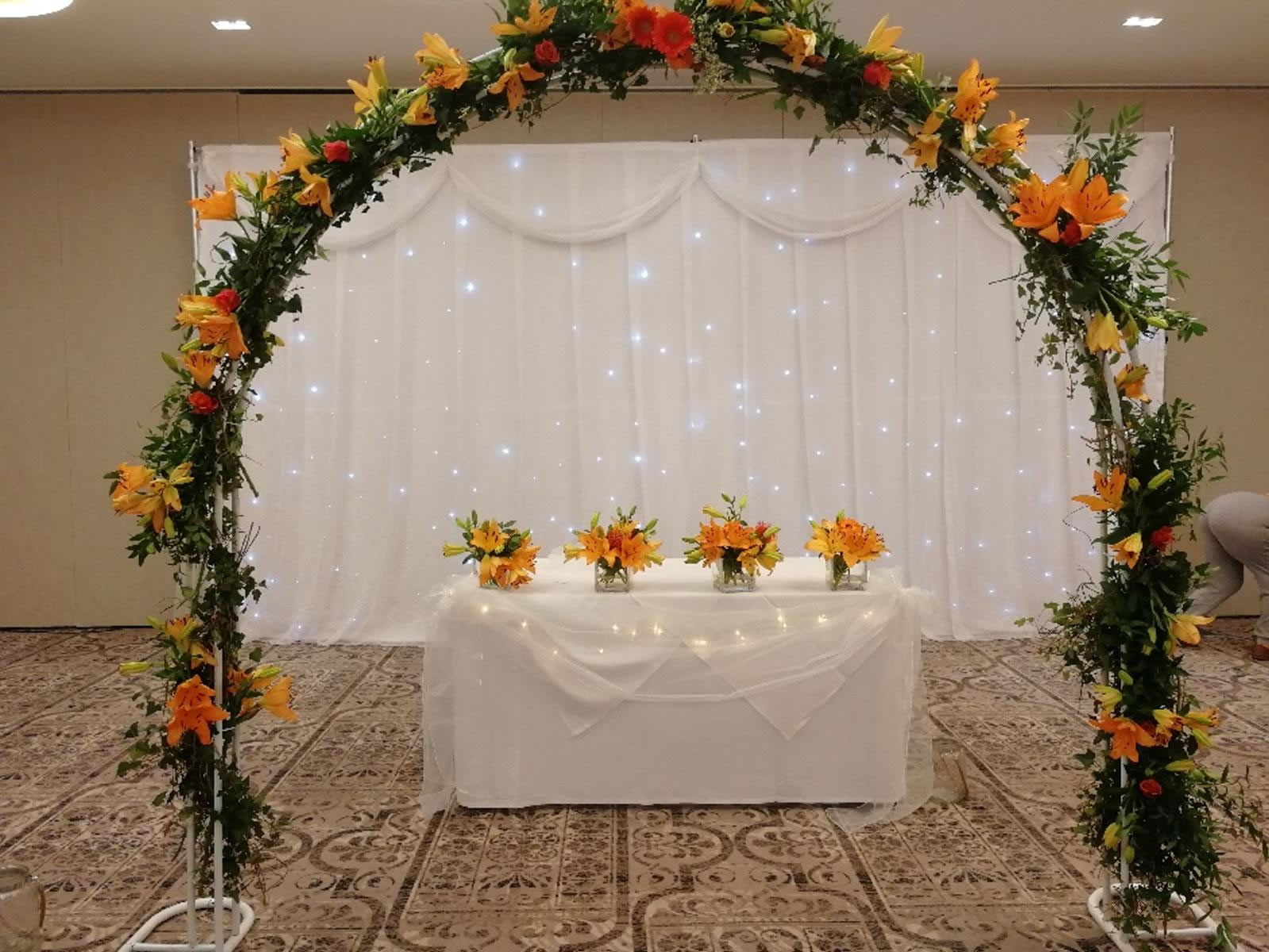 Arch made from beautiful orange flowers 
