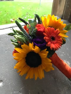 Beautiful vibrant orange wedding bouquet sunflowers